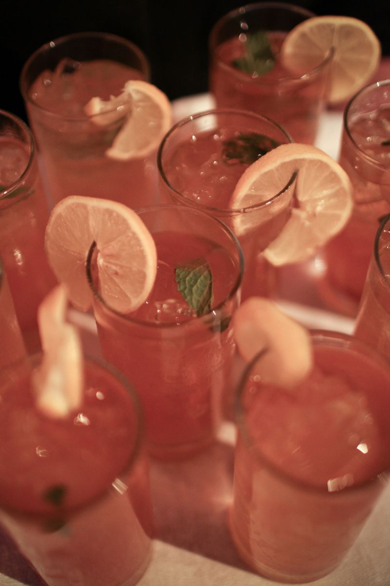 COOL HUES: Cru Catering garnished colorful refreshments with lemon slices and fresh basil.