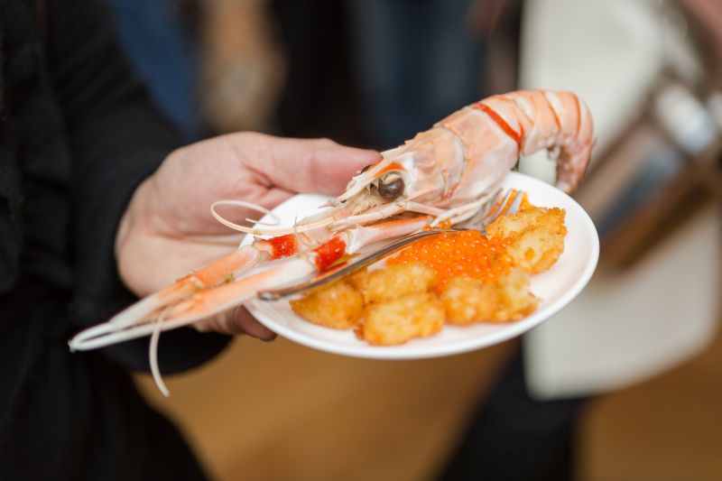 Guests ate their fill of langoustines and tater tots.