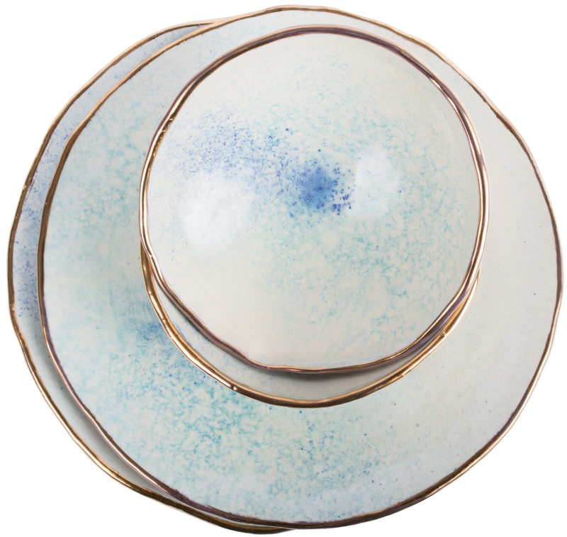 Jennings says she sees the moon in these gold-rimmed pieces from her new dinnerware line.