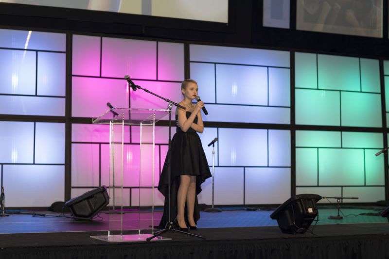 Morgan Pierce steps on stage to share her journey of childhood cancer.