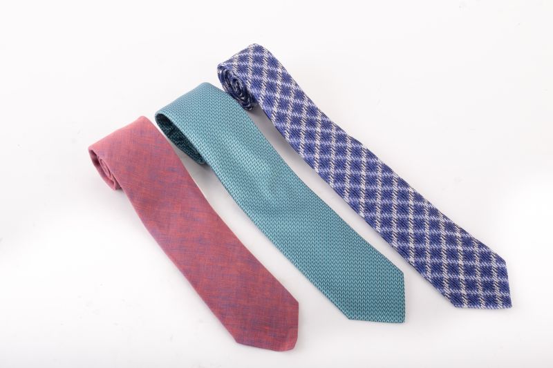(Left to right) Eton silk ties, $180 &amp; $145 &amp; Canali blue silk tie, $165 at Gwynn’s of Mount Pleasant
