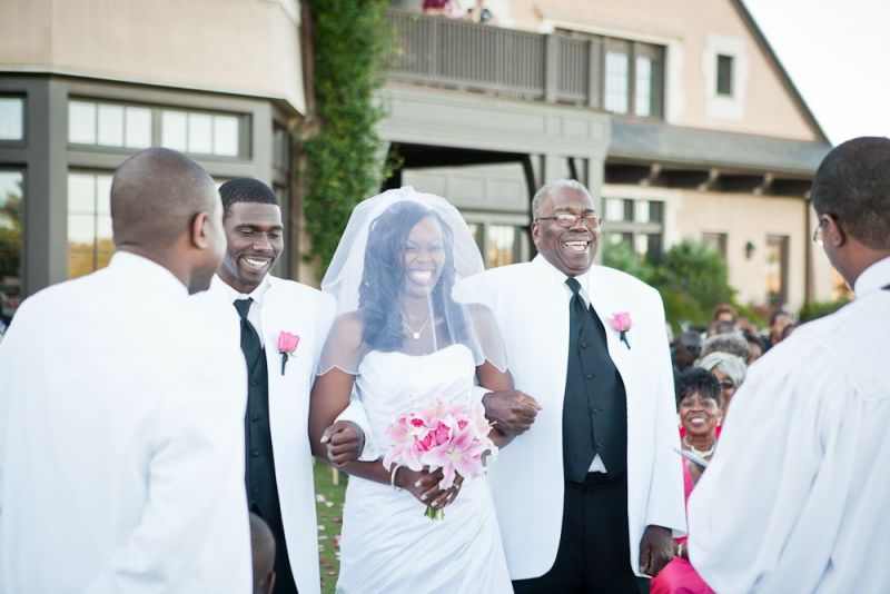 ARMED PROCESSION: Jaime was escorted down the aisle by her brother and paternal grandfather.