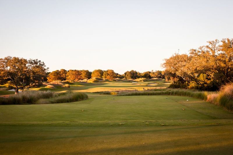 TEEING OFF: “The golf course was the perfect backdrop for the ceremony,” says the couple of their 5:00 p.m. wedding.