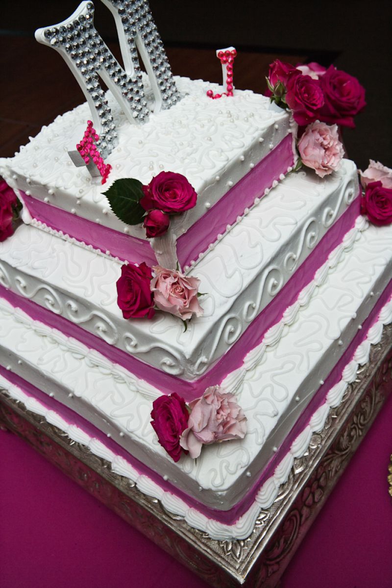 HOW SWEET IT IS: The buttercream cake (with buttercream icing),  from ABC by Ma’Shea, was crowned with a one-of-a-kind bejeweled topper, handmade by the bride herself. Jaime says of Ma’Shea: “She was a Godsend. My original baker fell through 10 days before the wedding. She came in and designed, baked, and delivered the cake as if I’d hired her over a year ago.”