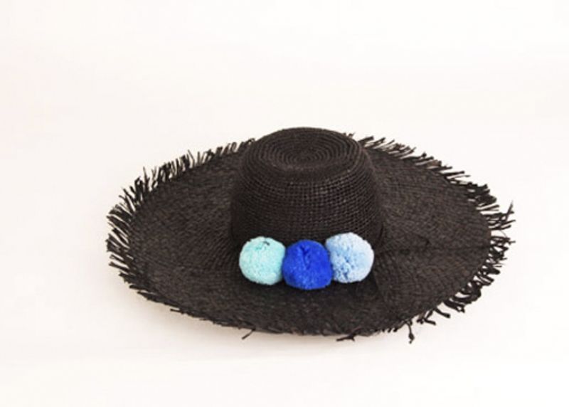 Pool to Party by Subtle Luxury “Pom Pom” hat in “black pool,” $84 at Julep