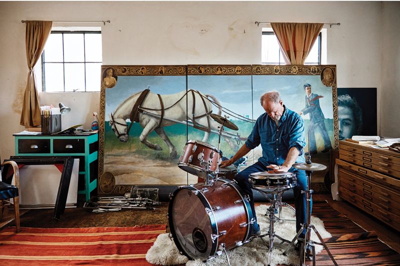 Boatwright plays drums and other percussion instruments in the band Minimum Wage; at his kit in front of Plowed Under, (acrylic on canvas, 11 x 6 feet, 2019) which he painted during a residency at the Gibbes Museum of Art.