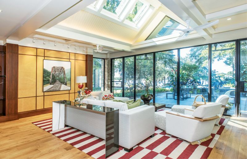 An Easy Out: Contemporary, casual, and flooded with light, the den is a sun-room and then some.
