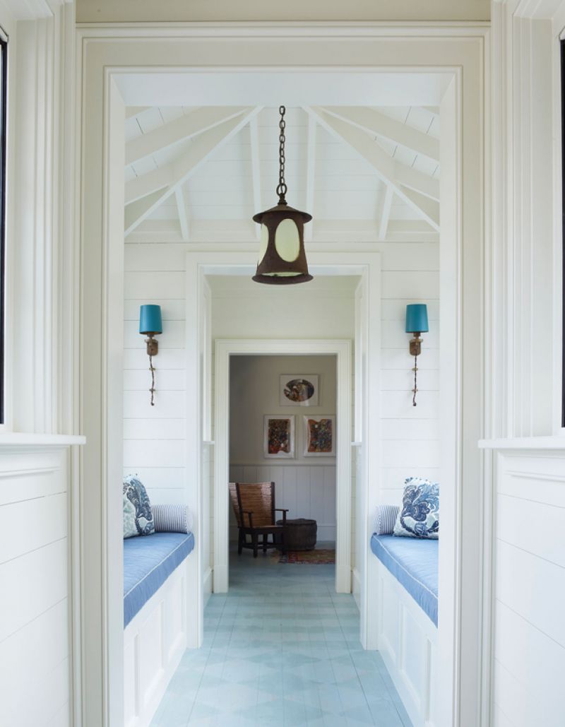 Bright Spot: This light-filled hallway connects the main residence to the guest house and also provides a pleasant place to sit and soak up the views. The painted white oak floor adds a whimsical touch.
