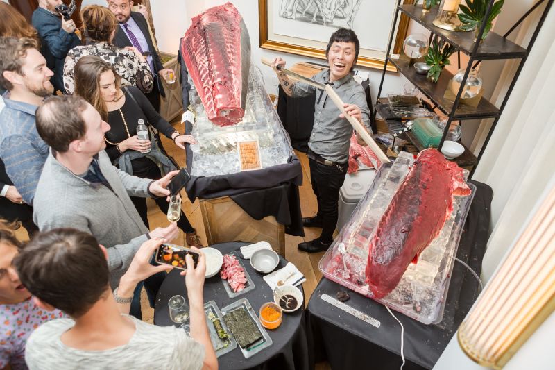 A sushi artist serves up fresh hand rolls