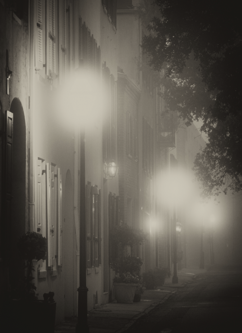 Street lamps glow at dawn along Elliott Street in the Historic District.