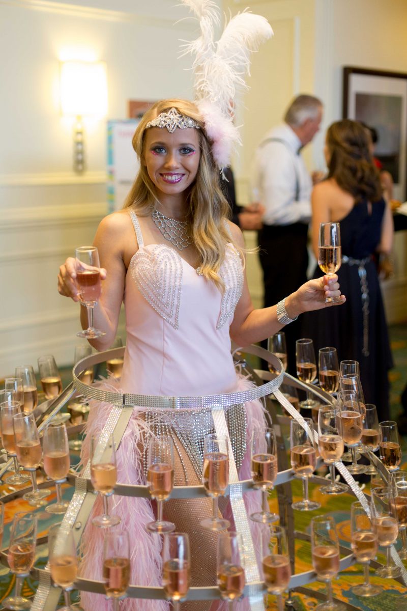 The lovely &quot;Champagne Lady&quot; served guests glasses of pink bubbly as they arrived.