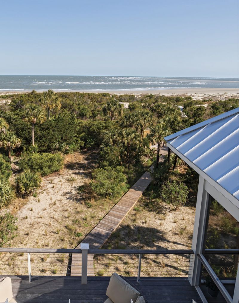 VIEW FROM THE TOP: The rooftop deck is shielded from the neighbors while offering a spectacular view of the island’s unspoiled beach and a great spot for wildlife watching. The couple is working on renewing the landscaping with native plants such as sweetgrass, dune sunflower, and broom sedge.