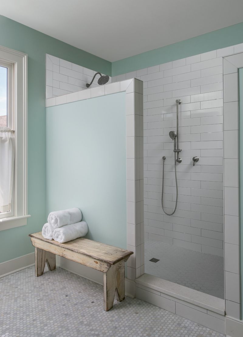 A tiled shower with no glass door makes the bath low-maintenance. “The design is a result of me hating to clean glass doors; I never wanted to see another squeegee again!” Cindy laughs.