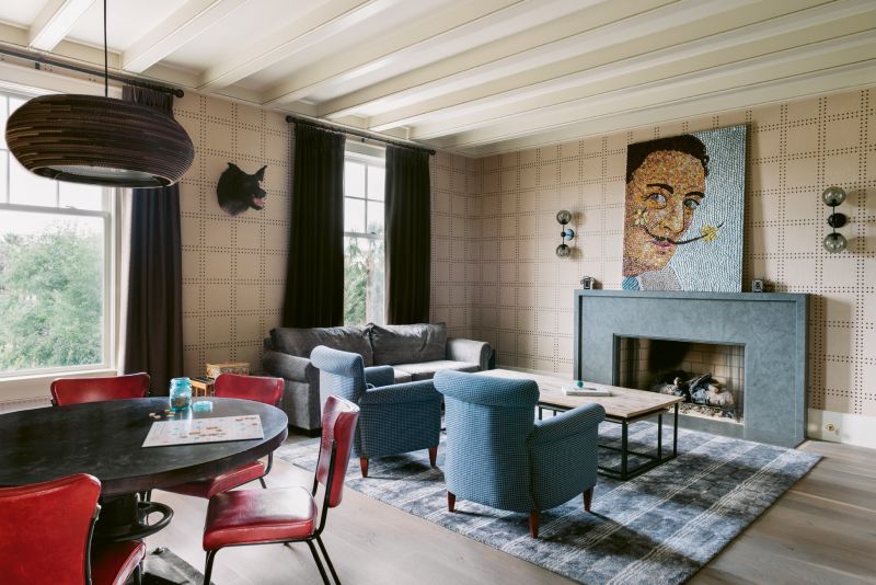 A glittering bottle-cap portrait of Salvador Dalí by local artist Molly B. Right and riveted wallpaper from Phillip Jeffries inject texture and a sense of glamour into the den.