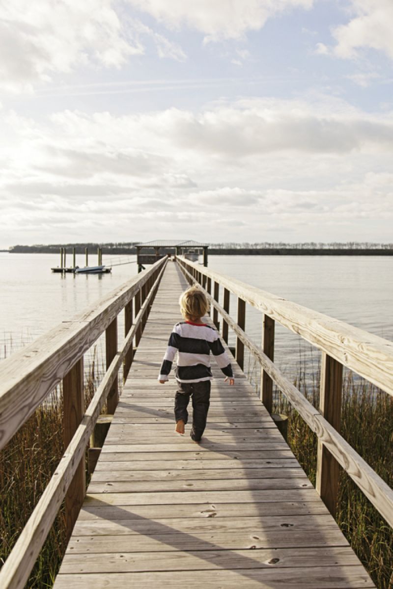 The Joyes’ dock feels like an extension of their living room. “It’s so fun for Finn, to have that connection to nature,” Becky says.