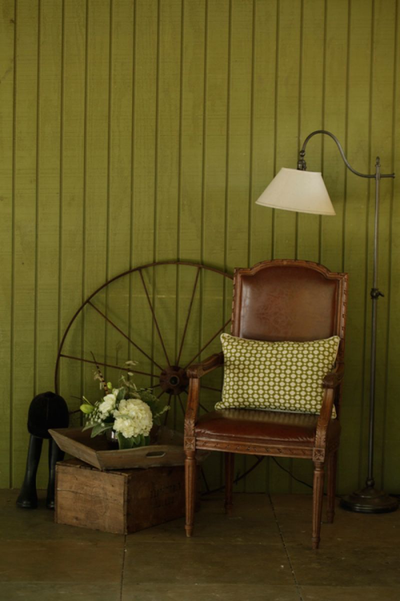 We asked the women of RiverOaks to dress the location in a Town &amp; Country meets Ralph Lauren vein. That lead to vignettes like this one, in the loggia. Props from Muster Branch Vintage Rental Co. by Lauren Heuber. Florals by Jennigray Hewitt of RiverOaks.