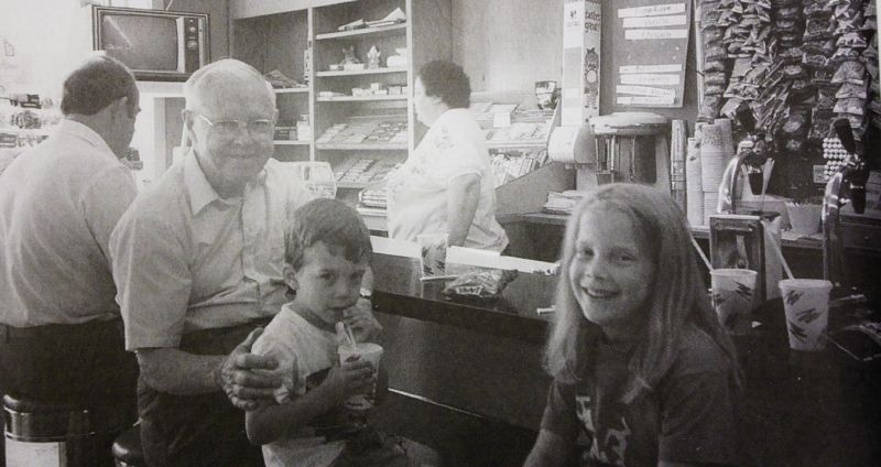 The soda fountain at the pharmacy with Miss Linda behind the counter