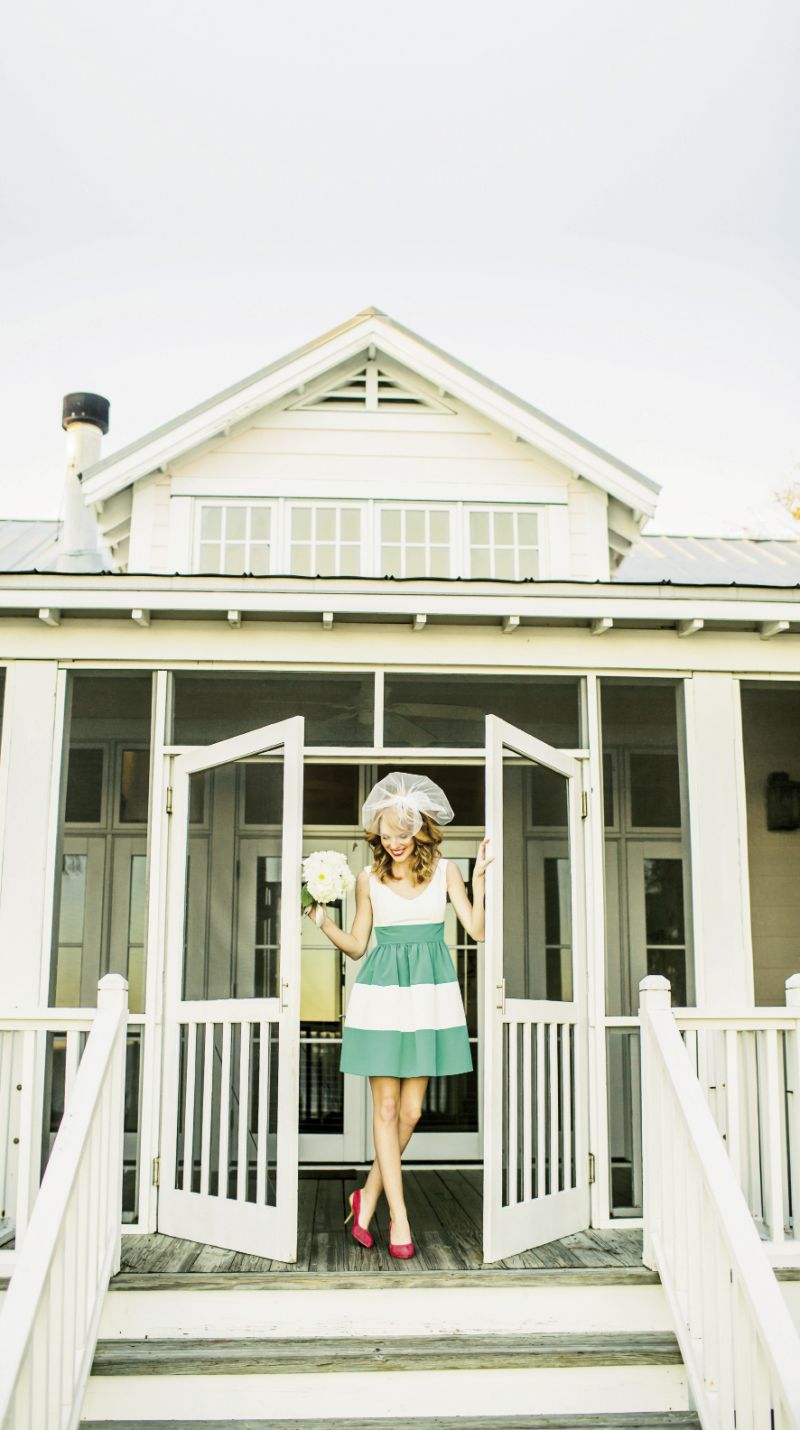 A STEP UP: LulaKate’s white and teal dress from Bella Bridesmaid. Bel Aire Bridal veil from Jean’s Bridal. Bracelet from Out of Hand. Guieseppe Zonotti’s coral suede pumps with wooden heels from Gwynn’s of Mt. Pleasant.