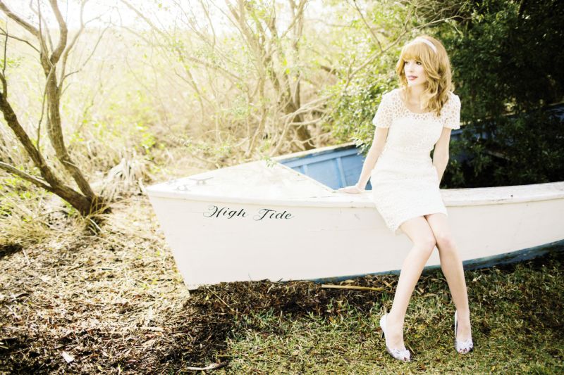FIRST MATE: Encore by Watters’ “Tikka” lace dress with grosgrain sash and Nina’s “Electra” silver satin d’Orsay pumps, both from Bella  Bridesmaid. Starlet  headband from Onawa Designs. Freshwater pearl bracelet with vintage Louis Vuitton button from Gwynn’s of Mt. Pleasant.