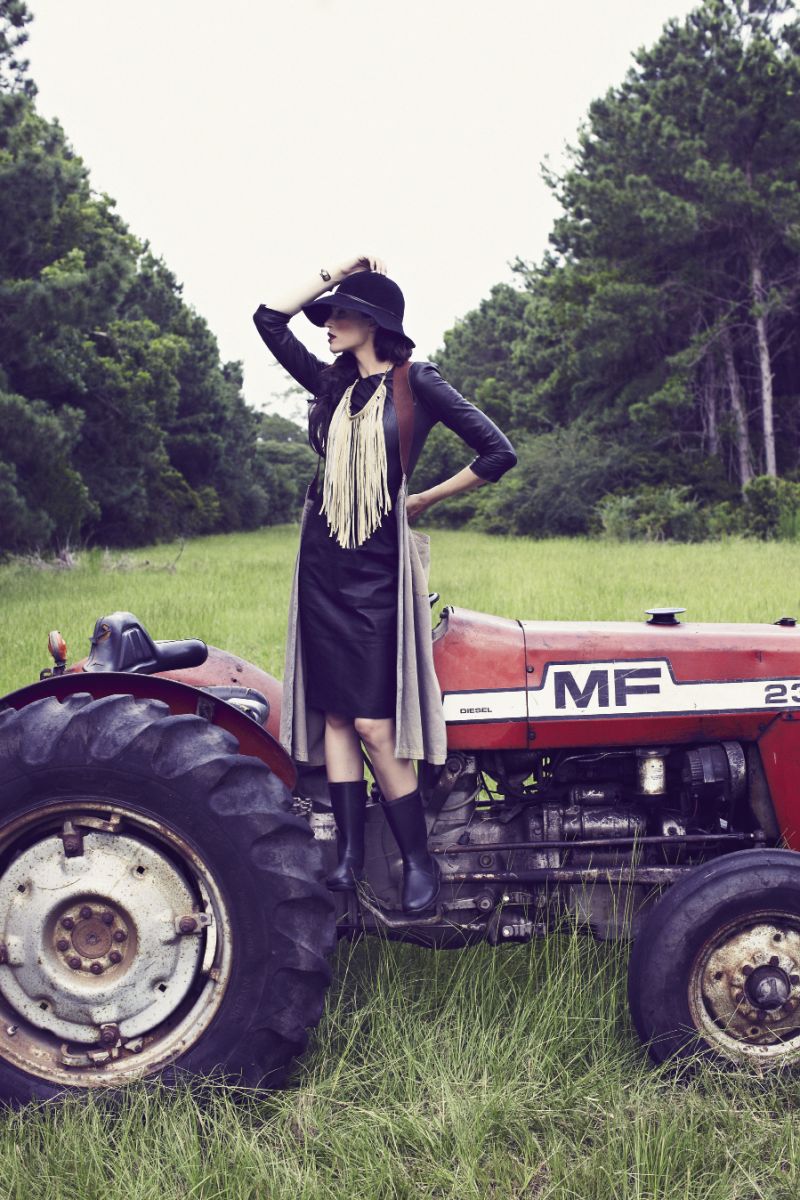 Malene Birger “Ortensa” leather dress, $955 at Hampden Clothing; STATE by Adrienne Antonson “Daylabor” skirt/smock, $310 at shop.nubegreen.com; Eric Javits “Moxi” hat, $350 at Gwynn’s of Mt. Pleasant; Mamie Ruth leather necklace, $74 at mamieruth.com; polyesterstella cuff, $250 at etsy.com; wellies,  stylist’s own
