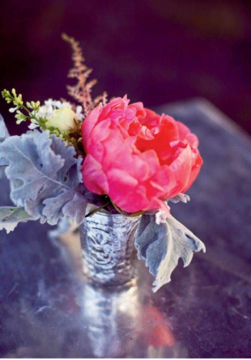 TINY TOUCHES: Playing with the downhome theme and a palette of pinks and corals, Whitney placed small heirloom-style vases of colorful peonies throughout the reception.