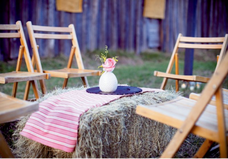 Hay Day: Sarah met with Whitney of Branch Design Studio every other week to hash out ways to incorporate everyday elements into the reception, like this bale turned ottoman-coffee table.