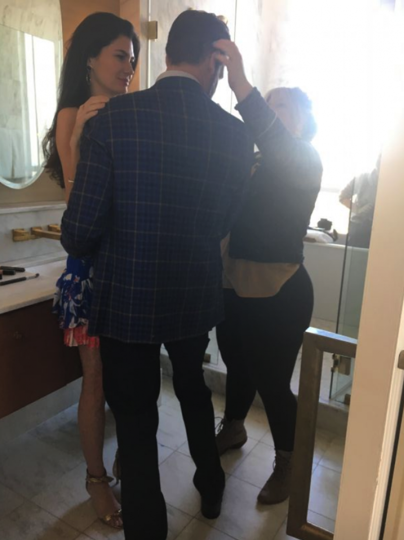 gets the couple prepped for the bathroom shot.