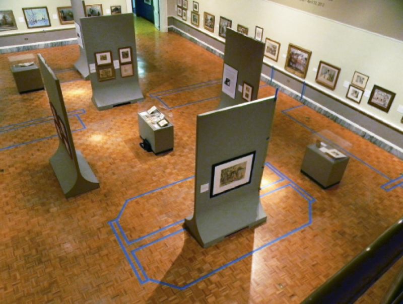 The same space taped off in 2012 by the designer and curatorial staff to envision new displays