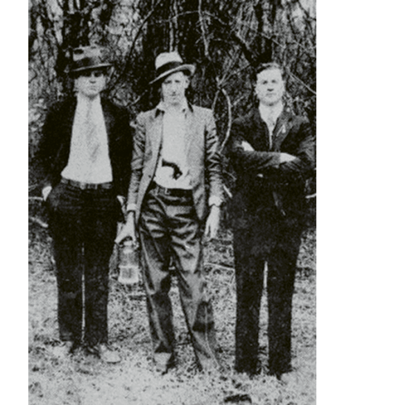 (Left to right)  Al Capone, David Shuler, and an unknown man in Hell Hole Swamp; “Mr. Shuler ran a mercantile store in Jamestown. This photo hung in his store until it closed,” says Jamestown resident Douglas Guerry.