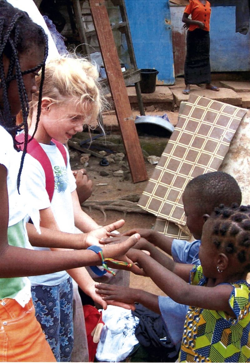 hop14.jpgConnections: Ignoring the language barrier, visitors from Charleston play games with young Ghanian children.