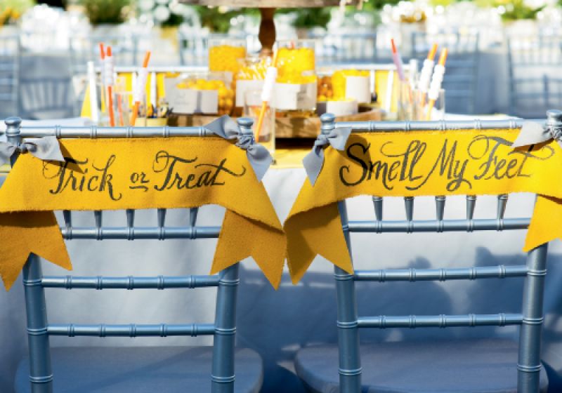 Banner Idea: Calligrapher Elizabeth Porcher Jones penned Halloween sayings on banners hung from the kids’ chairs. The dressy treatment meant the table meshed with the regular reception trappings and kids were thoroughly included.