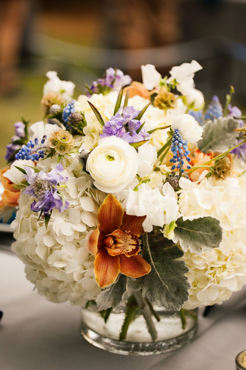 place cards bearing the wedding’s signature watermark design dangled from a Spanish moss-covered board.