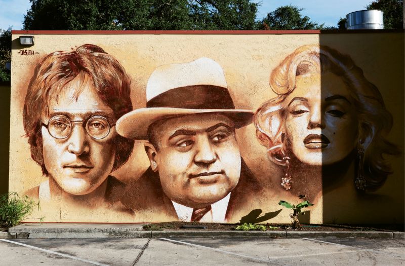 Untitled  by Sergio Odeith  July 2016  Moe’s Southwest Grill,  (900 Houston Northcutt Blvd., Mount Pleasant)  The fast-casual food franchise commissioned the renowned Portuguese painter and muralist to visually convey the company’s acronym (“Musicians, Outlaws, and Entertainers”). The artist, known for his anamorphic 3-D art as well as his portraiture, completed these visages of John Lennon, Al Capone, and Marilyn Monroe this summer. Odeith has other murals in the area, including on Huger and Hanover Streets for enough pie’s “Awakening III,” on a Hester Street residence, and indoors at the Children’s Museum of the Lowcountry.