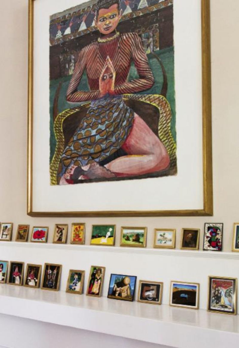 Artist Richard McMahan’s miniature replicas of notable masterpieces and a painting by a Georgia artist known as “St. Eom“ in the guest bedroom.