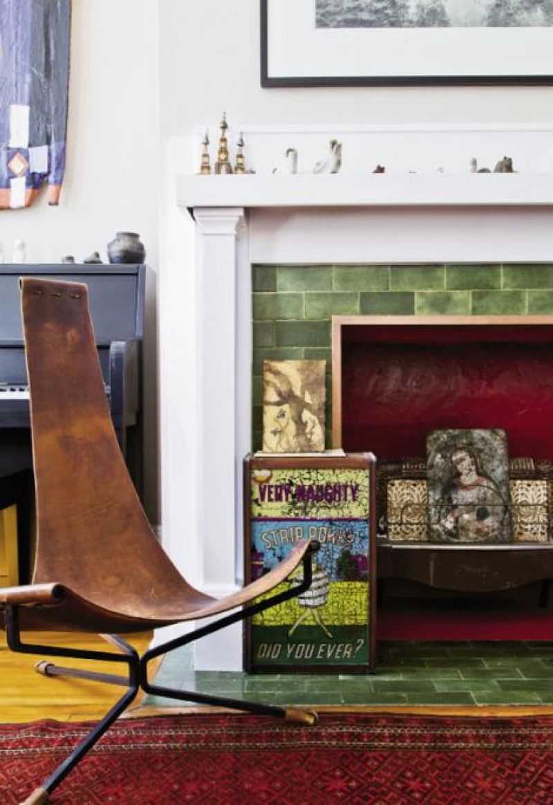 Zuni fetishes line the mantel in the living room, accompanied by a leather sling chair and the top portion of a penny arcade.
