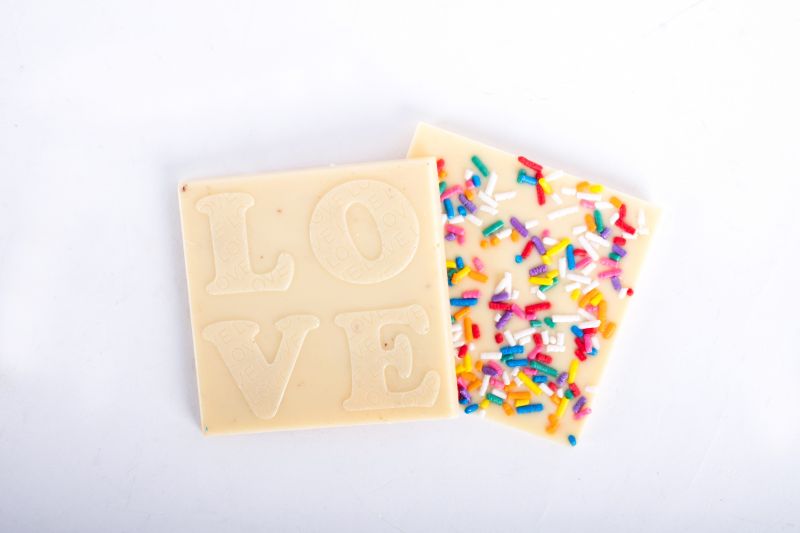White chocolate &quot;Love&quot; square with sprinkles, $4 at Christophe Artisan Chocolatier