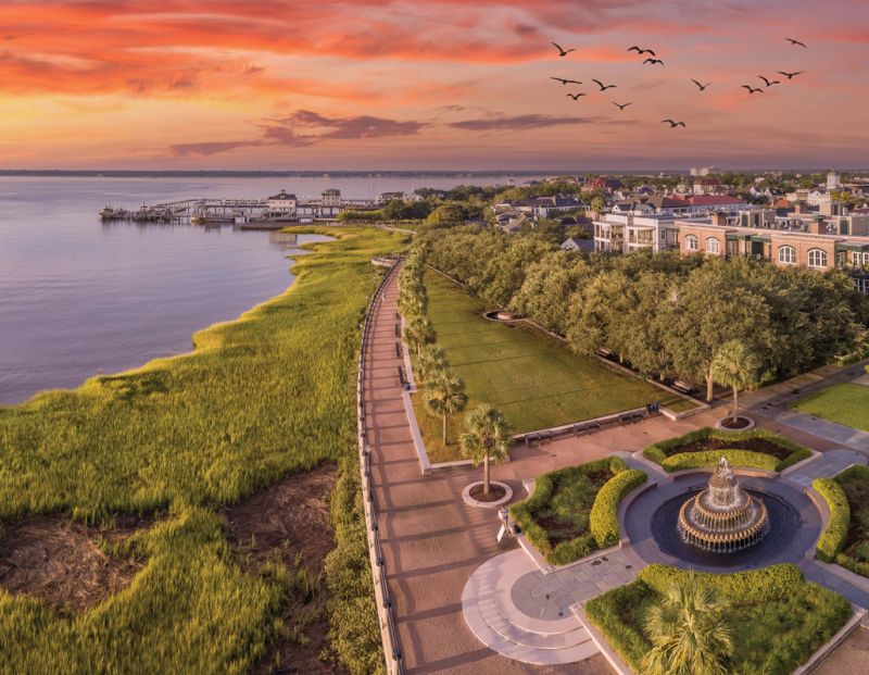 A WATERFRONT FOR ALL:  The opening of Waterfront Park in 1990, right after Hurricane Hugo, has been transformative for the city. The forthcoming The Cooper hotel, which will enjoy a vista similar to this aerial view, will continue the park’s path in front of the hotel, eventually connecting the waterfront to the South Carolina Aquarium and International African American Museum.