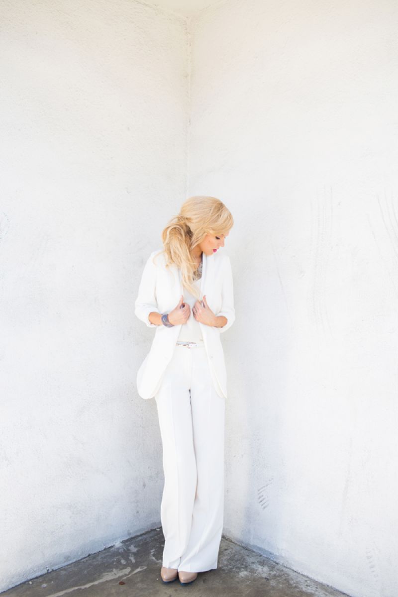 Mantu jacket and pants, price upon request at RTW; Julie Brown blouse, $162 at Copper Penny; Whitley V fringed necklace, $42 at Copper Penny; Van H. carved agate cuff with diamond detail, $350 at vanhjewelry.com; Reptile’s House of Italy leather belt with wood and silver detail, $242 at Rapport; Me Too patent leather pumps, $109 at Copper Penny Shooz