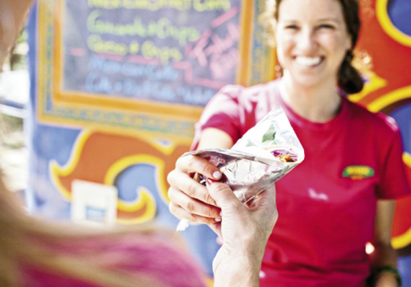Courtney Parades hands out fare from the colorful truck