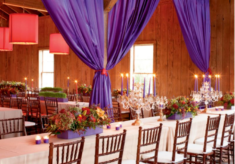 GLITZ &amp; GLAMOUR: Long tables created an at-home feeling amidst the extravagant décor and lush setting, resplendent with flower boxes that spilled forth Asiatic lilies, cabbage roses, hydrangeas, and hypericum berries.