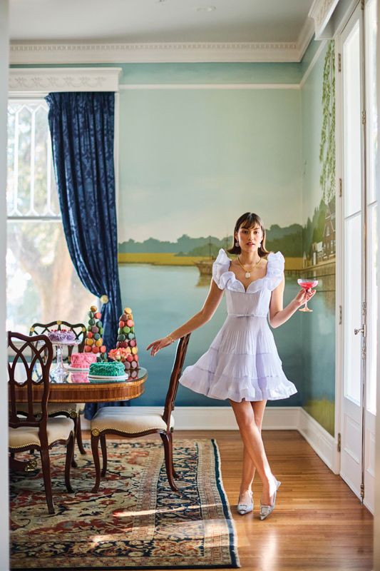<strong>Sweet Nothings:</strong> Zimmermann “Pleated Frill” mini dress, $695 at <a href="https://www.gwynns.com/collections/mini/products/pleated-frill-mini-dress-light-blue-0" target="_blank">Gwynn’s of Mount Pleasant</a>; Rebeka Hakimi rose gold, chalcedony, and diamond earrings, $2,900 at <a href="https://diamondsdirect.com/" target="_blank">Diamonds Direct</a>; Sarah Amos handcrafted 22K-gold chain necklace, $19,500, and moonstone pendant, $5,600, at <a href="https://helenafoxfineart.com/" target="_blank">Helena Fox Fine Art</a>; Capucine De Wulf “Meadow” cuffs, $98 each at <a href="https://capucinedewulf.com/collections/bracelets/products/meadow-companions-petite-cuff-gold" target="_blank">Juliska</a>; Sam Edelman “Kaitlyn” sling-back pumps, $130 at <a href="https://shoesonking.com/products/kaitlyn-cape-blue?_pos=1&amp;_sid=4180b3d42&amp;_ss=r" target="_blank">Shoes on King</a> - (Props) Champagne coupe and cake stand from <a href="https://estellecoloredglass.com/" target="_blank">Estelle Colored Glass</a>; cakes and macarons from <a href="https://www.swankdesserts.com/" target="_blank">Swank Desserts</a>