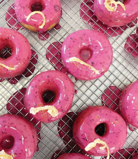 Blueberry glazed doughnuts with candied lemon