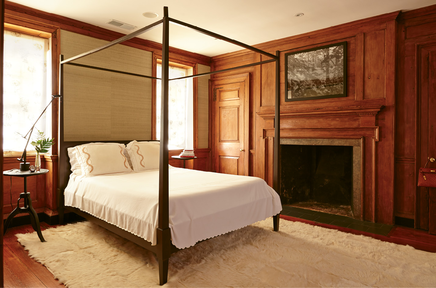 Original cypress paneling lends a dignified air to the master bedroom.